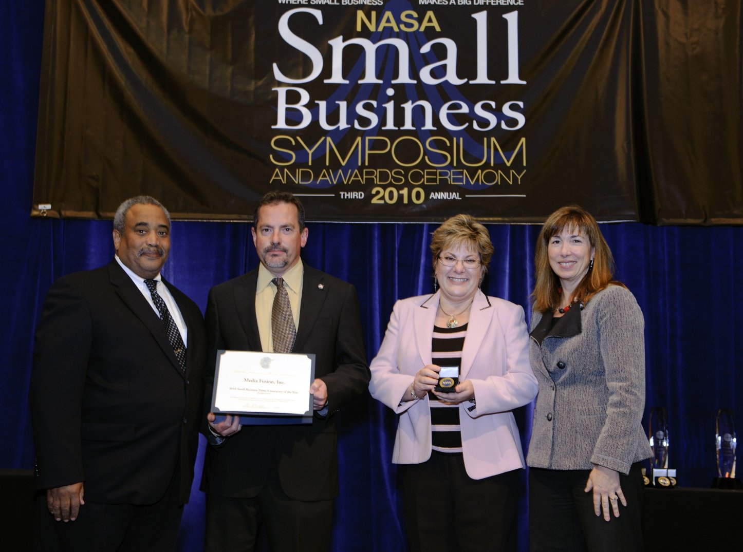 Media Fusion founder Tim McElyea receiving an award at the 2010 NASA Small Business Symposium