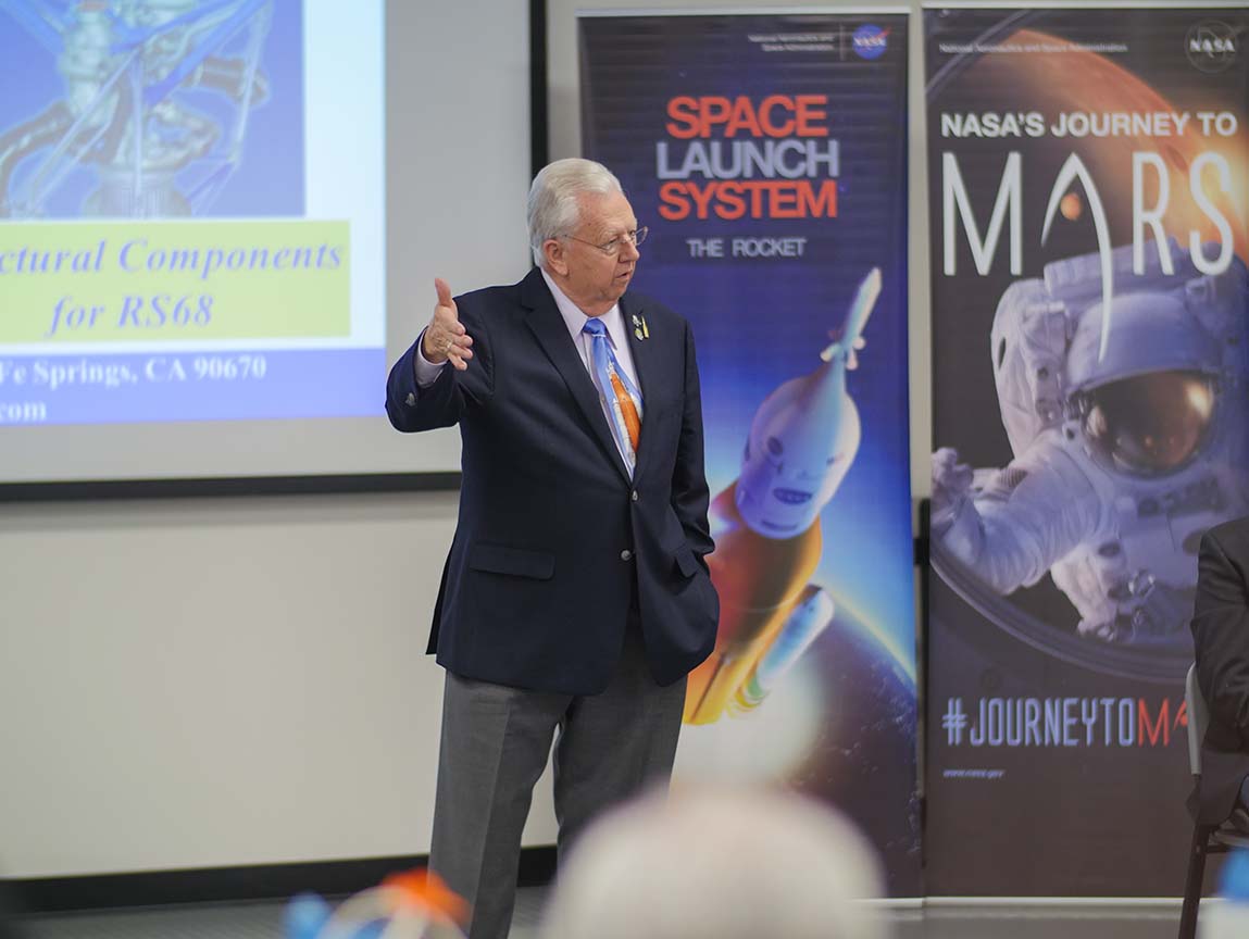 A photo of a NASA official delivering a presentation